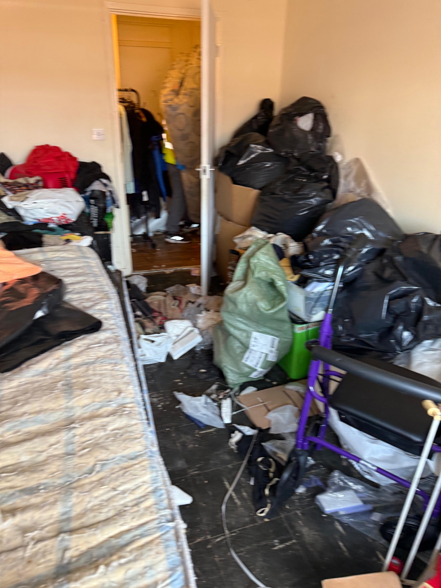 Hallway lined with bagged contents during a recent clearance
