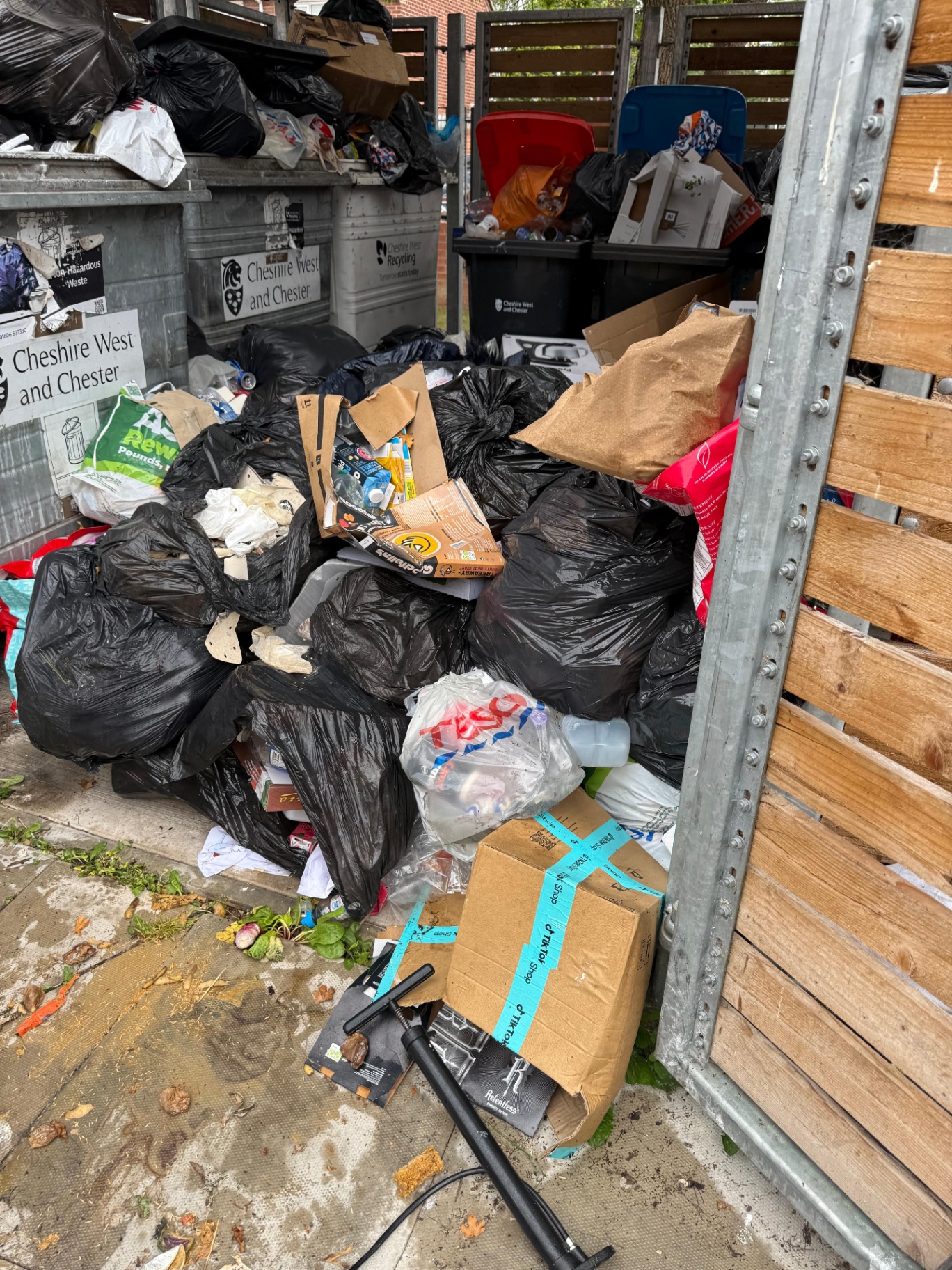 Black bin bags cleared from an alleyway under a Waste Transfer Note