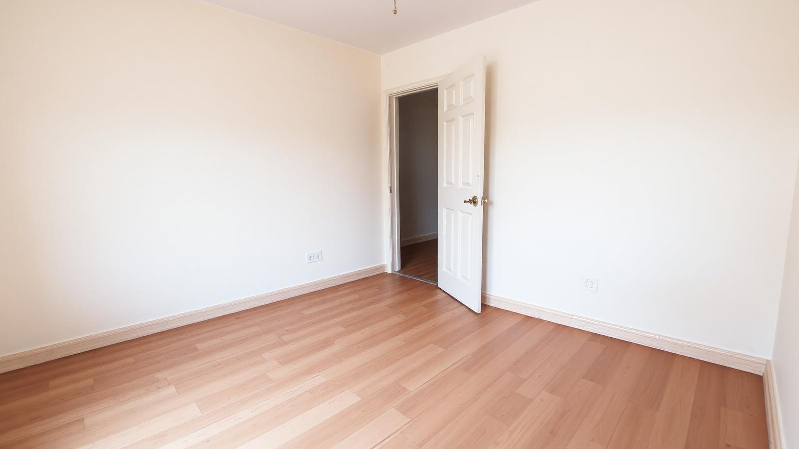 Cleared void rental property with bare floors and blank walls ready for re-let